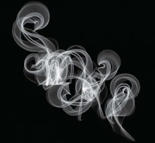 Liquid Smoke is created by passing wood smoke through a water medium. It's not artificial. it's the real deal and makes a great addition to the chef's pantry!